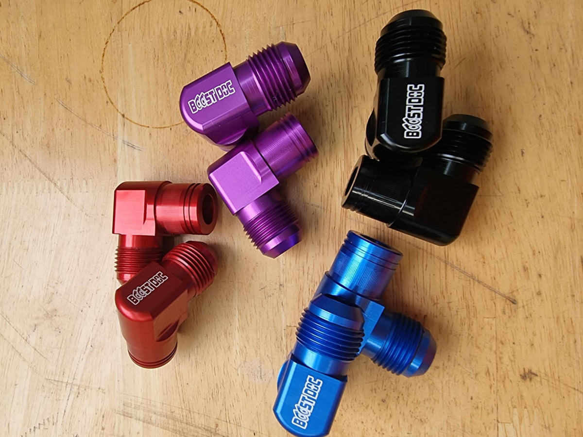 A set of 90° rocker cover breathers outlets for RB engines, displayed in various colors (red, blue, purple, black) multicolor billet cnc 