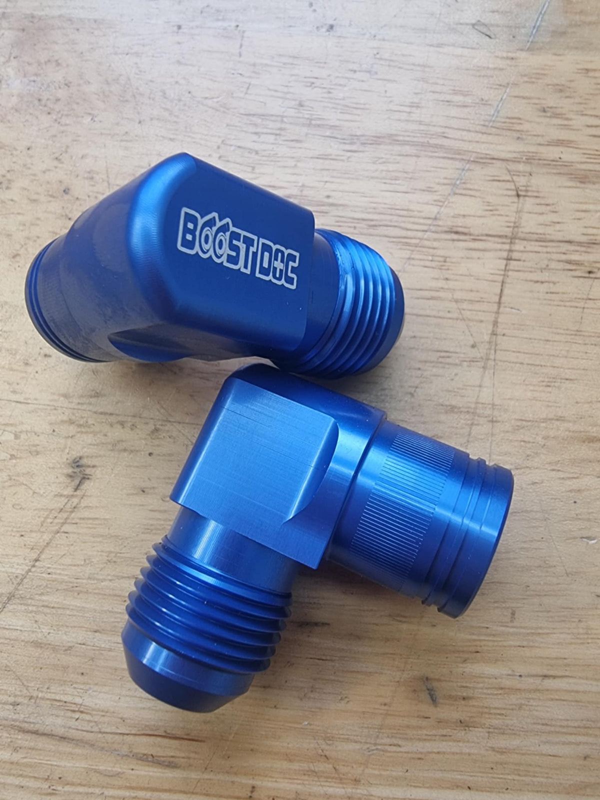 A set of 90° rocker cover breathers outlets for RB engines, displayed in various colors (red, blue, purple, black) multicolor billet cnc blue series