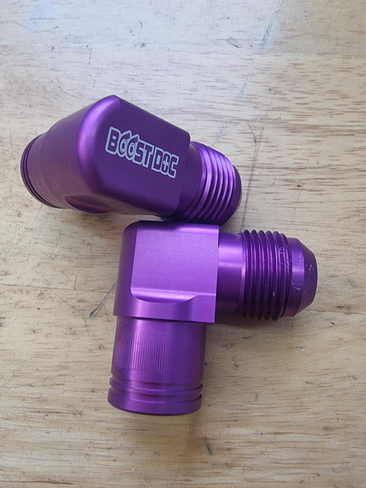 A set of 90° rocker cover breathers outlets for RB engines, displayed in various colors (red, blue, purple, black) multicolor billet cnc purple series