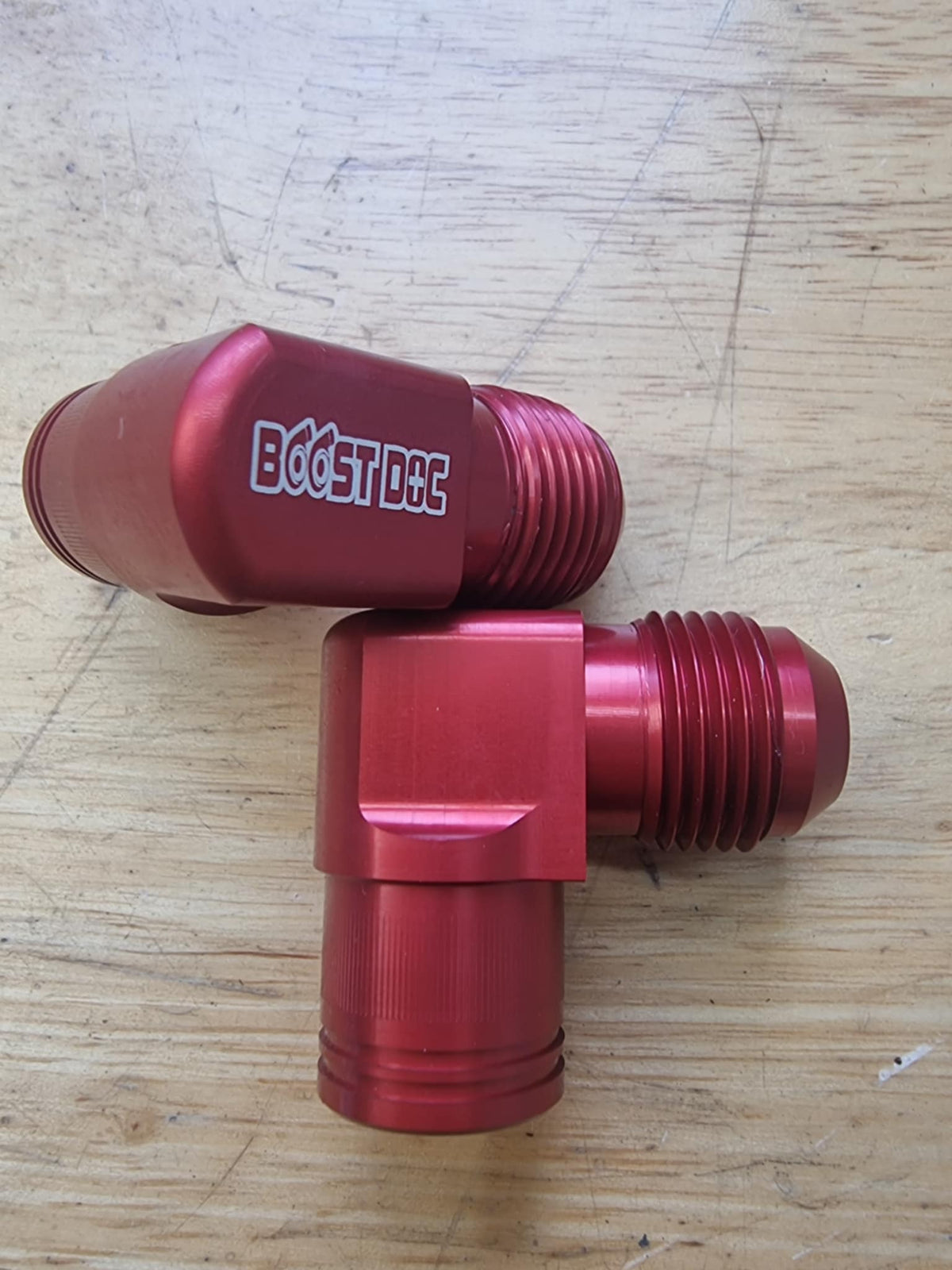 A set of 90° rocker cover breathers outlets for RB engines, displayed in various colors (red, blue, purple, black) multicolor billet cnc red series