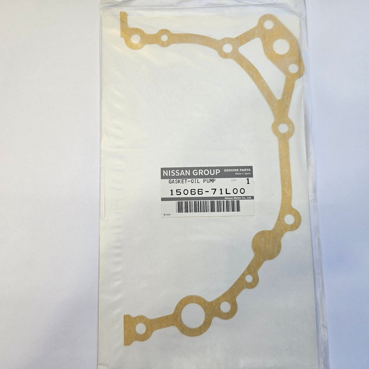 Nissan oil pump gasket in packaging on a white background, genuine part, oem nissan