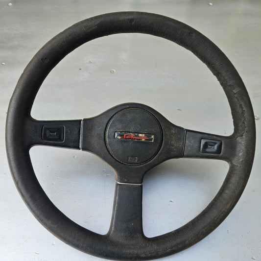 stock Nissan steering wheel with pad