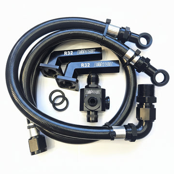 Black metal and braided hose kit with silver fittings, including two braided hoses with eye bolts, two black quick-connect couplers labeled R32, two black O-rings, and a black valve component, arranged on a white background.
