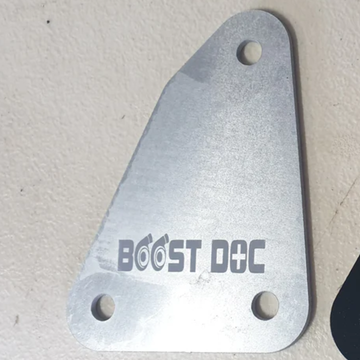 A raw aluminum finish speedo blancing plate for R32 Skyline with the text 'BOOST DOC' engraved on it R32 Speedo Firewall Blank skyline oem nissan parts gtr stagea safero r32 r33 r34 rb neo rb25 rb26 rb30