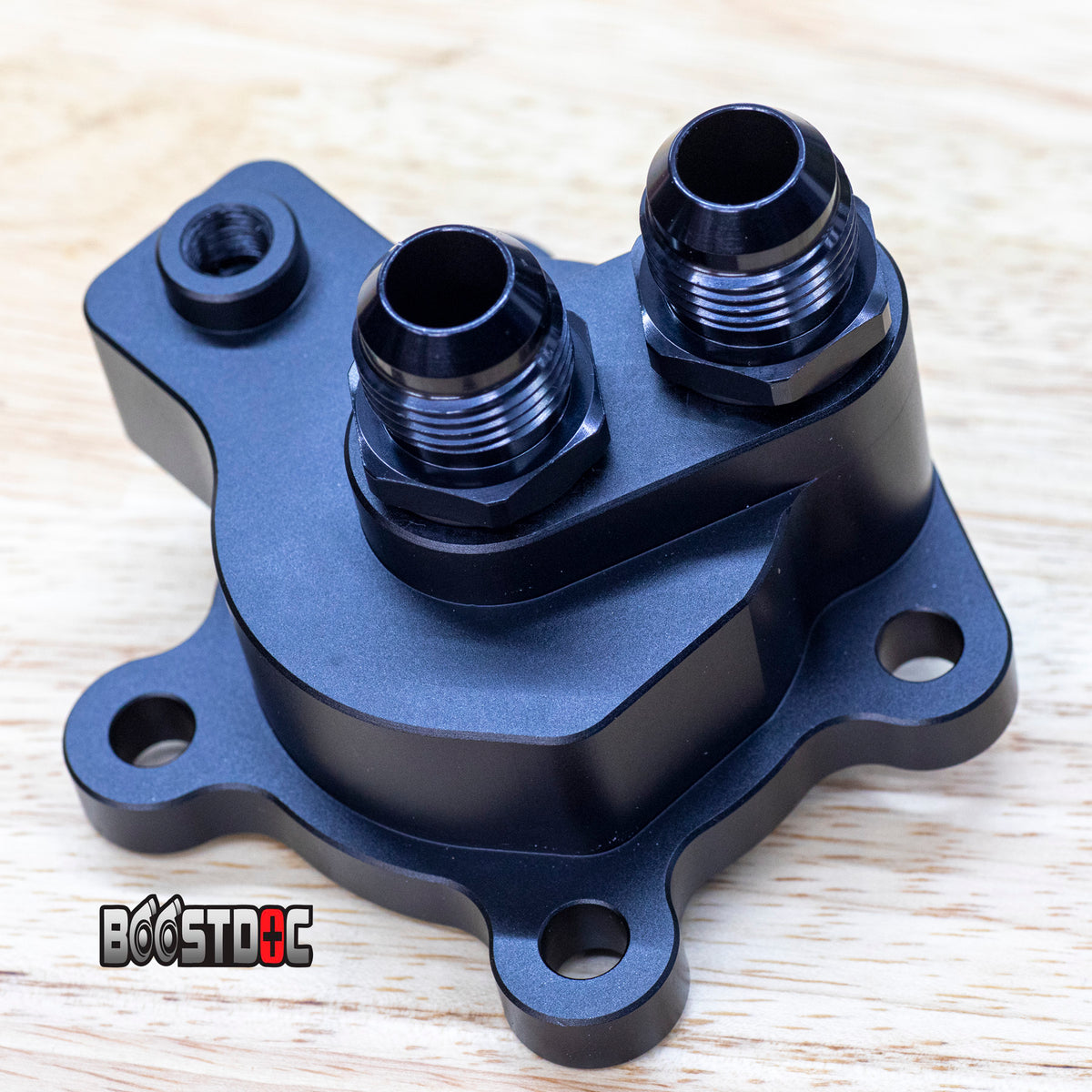remote oil filter housing outlet block. AN10 hoses. 

