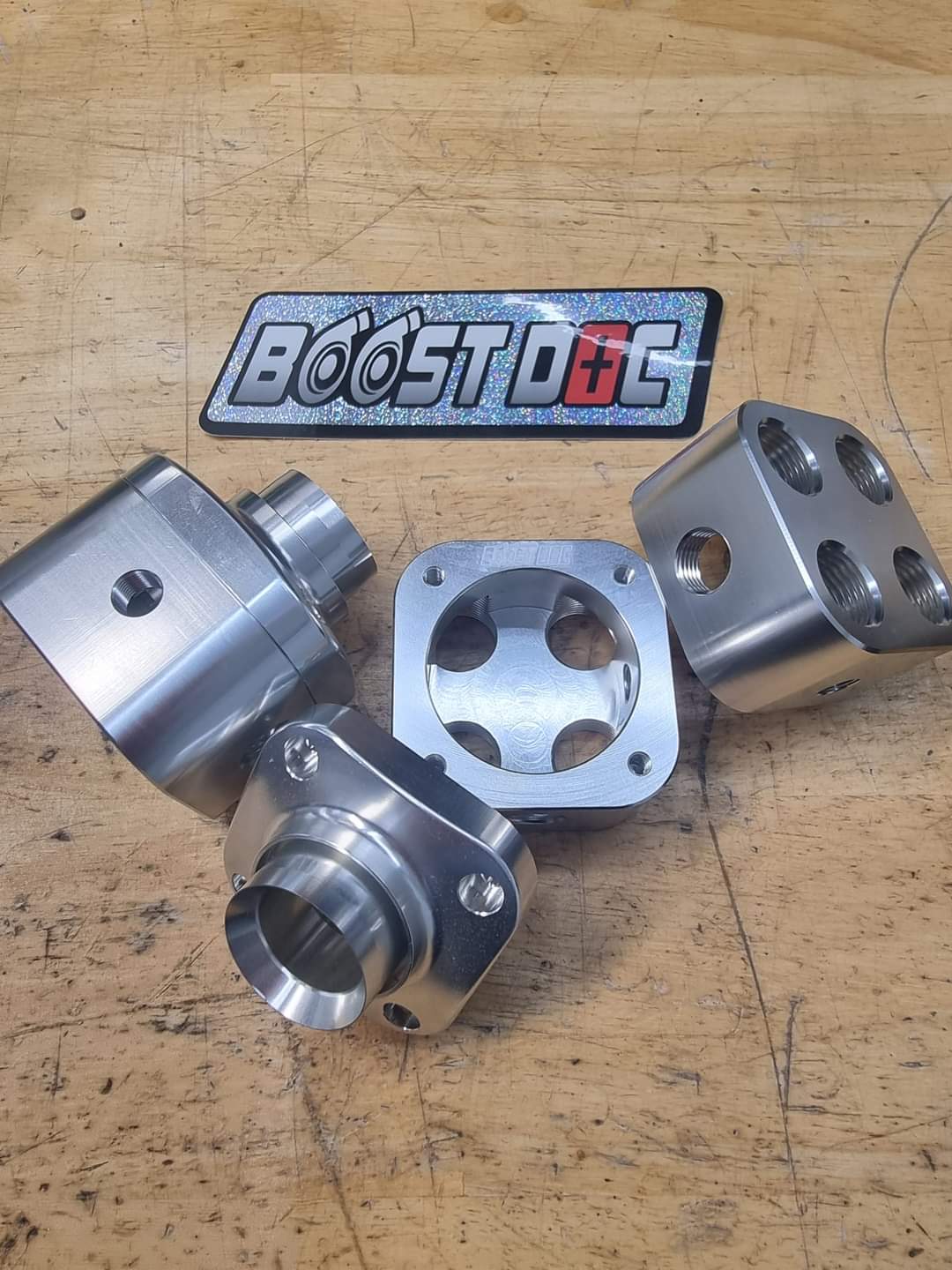 Press fit radiator adapter for custom intake manifolds, outlet, puke tank, surge tank