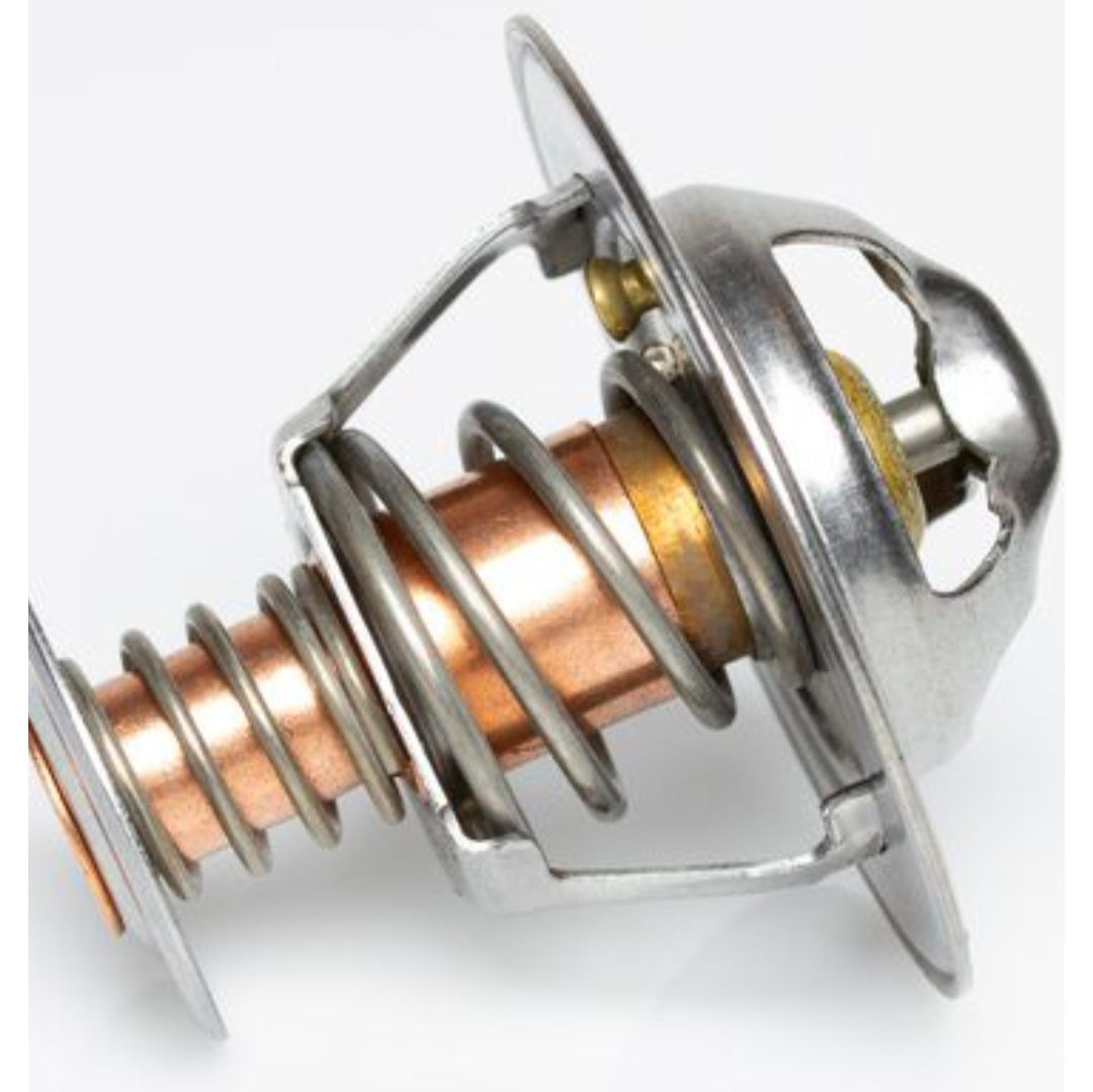 A close-up image of a Tridon high-flow thermostat, showing a metal body with spring mechanisms and a brass valve.