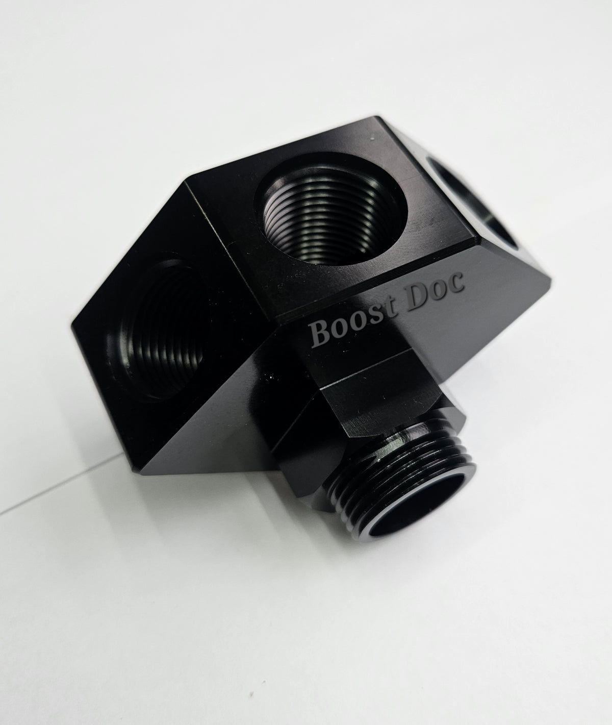 Black anodized CNC adapter fitting hub block for RB25 and RB30. Fits 3/4 block thread to allow multiple AN10 hoses 