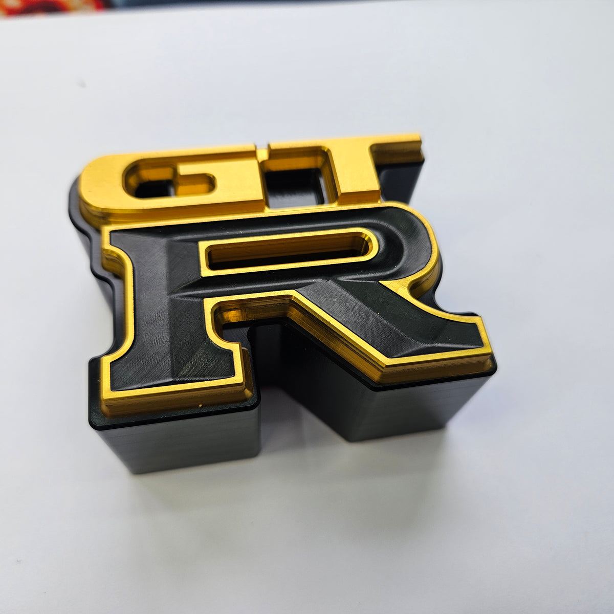Upgrade Nissan GTR Skyline Billet and Titanium Badges goldblack badge with backing
