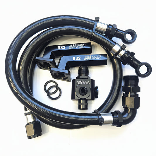 Black metal and braided hose kit with silver fittings, including two braided hoses with eye bolts, two black quick-connect couplers labeled R32, two black O-rings, and a black valve component, arranged on a white background.
