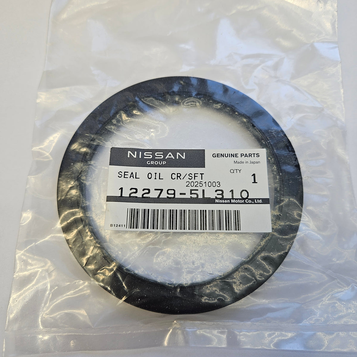Nissan oil seal in packaging with a visible barcode and label.