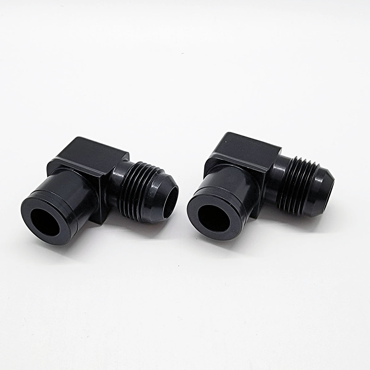 A set of 90° rocker cover breathers outlets for RB engines, displayed in various colors (red, blue, purple, black) multicolor billet cnc black face down
