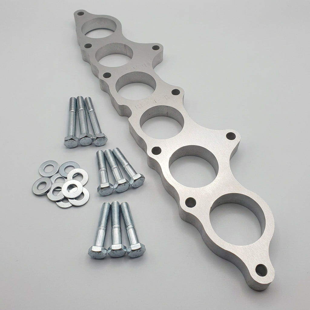 Plenum spacer to increase power, fit larger injectors, stock intake manifold.